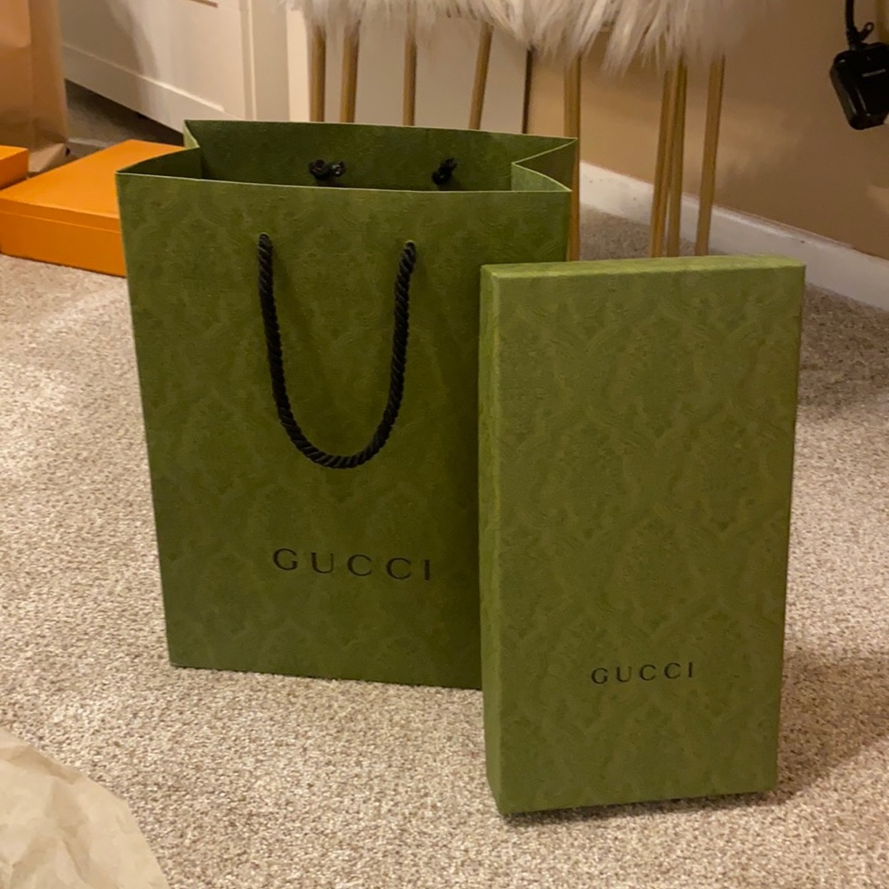 Green Gucci paper bag and sandal box